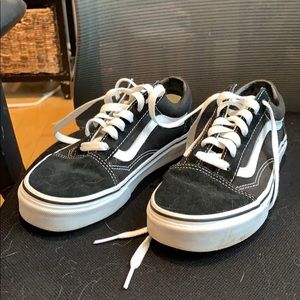 Black trendy sneakers by Vans
